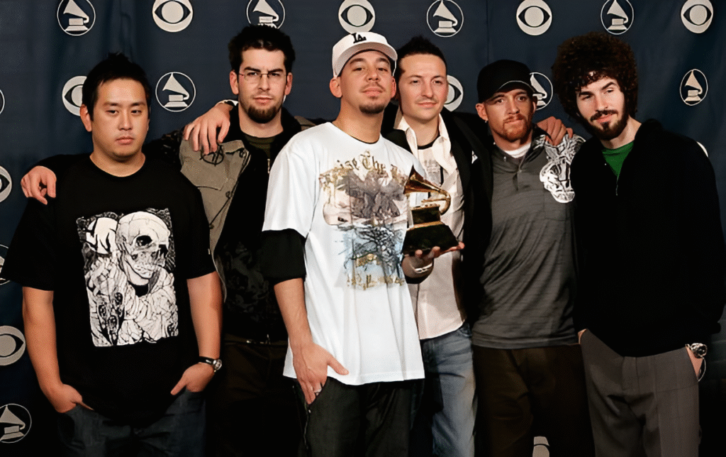 The group Linkin Park poses with their award in the press room at the 48th Annual Grammy Awards