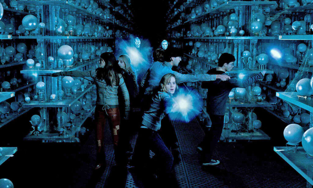 Dumbledore’s Army battles Death Eaters in the Hall of Prophecy — a moment where powerful spells like Reducto and Stupefy light up the wizarding world.