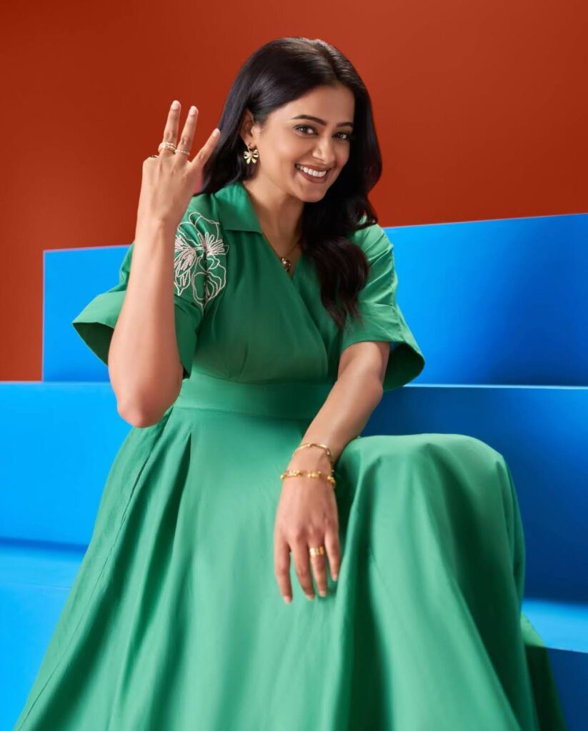 Priyamani beams with joy in this colorful promotional portrait.