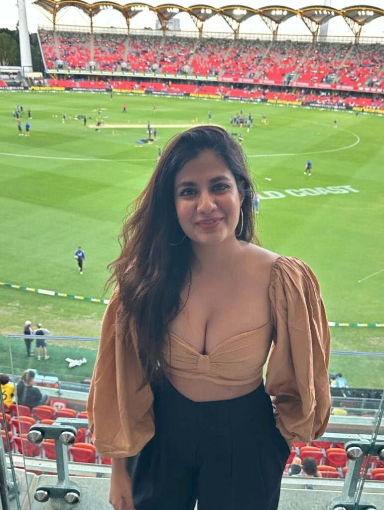 A stylish stadium shot with the cricket field and crowd setting the perfect backdrop.