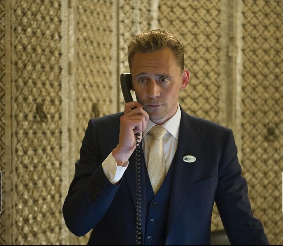 Tom Hiddleston in a tense phone scene from The Night Manager, a realistic spy thriller series like Jack Ryan