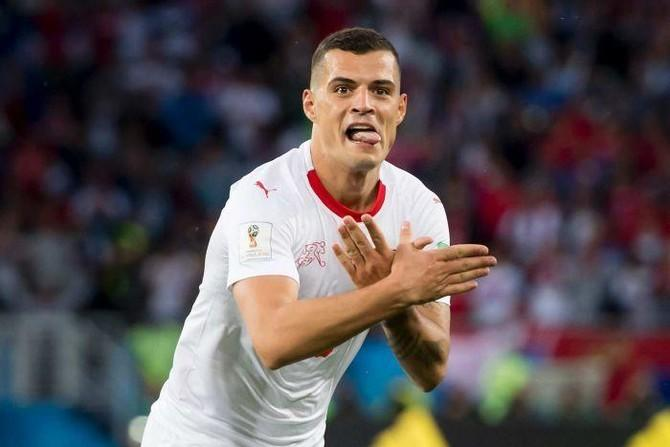 Granit Xhaka performing the famous Double Eagle celebration after scoring for Bayer Leverkusen