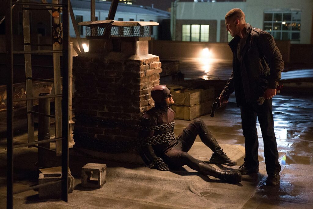 The Punisher confronting Daredevil during their iconic rooftop scene in Season 2